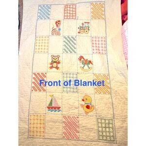 yellow handmade cross stitch baby blanket dated nuresery